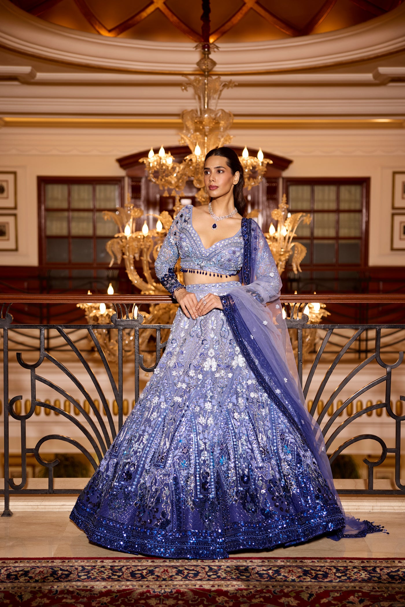 Statement blue ombre lehenga with heavy sequins and floral applique by Indian couture brand Opus Atelier