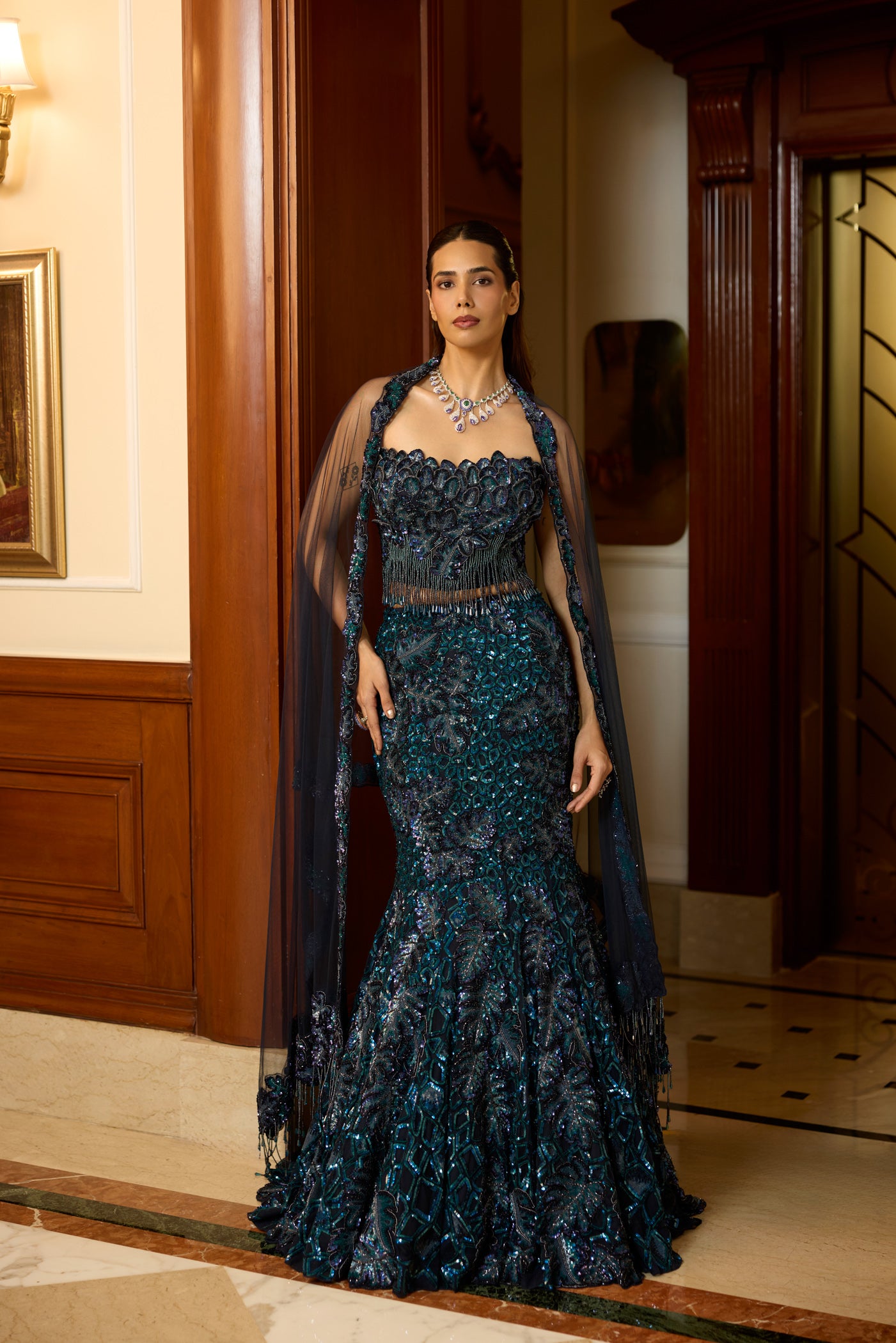 Handcrafted fishcut lehenga in peacock blue – perfect for cocktail  and weddings. Explore luxury couture at Opus Atelier.