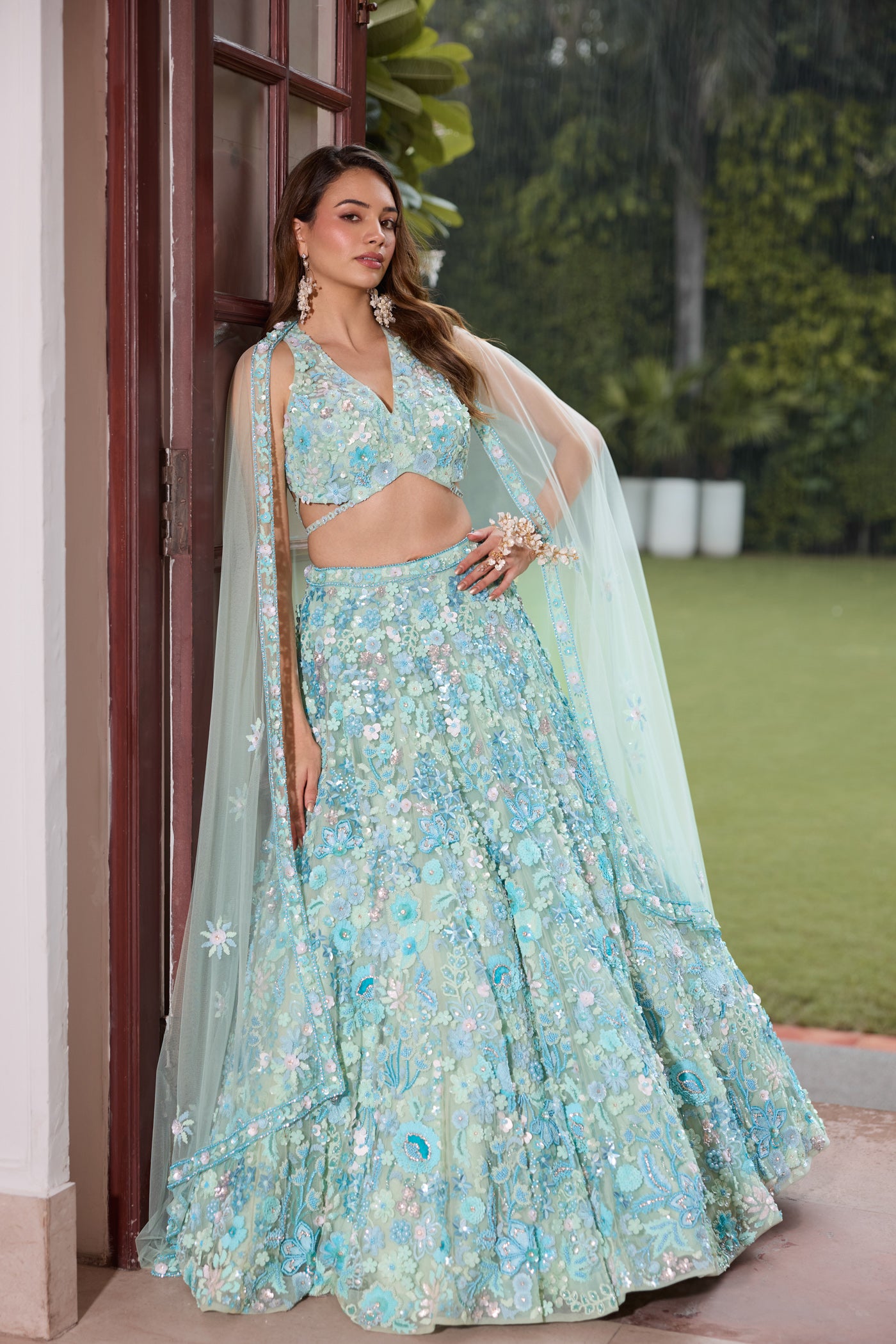 Aqua blue floral embroidered lehenga set with blouse and dupatta by Opus Atelier, handcrafted for modern brides, festive wear, and sangeet weddings