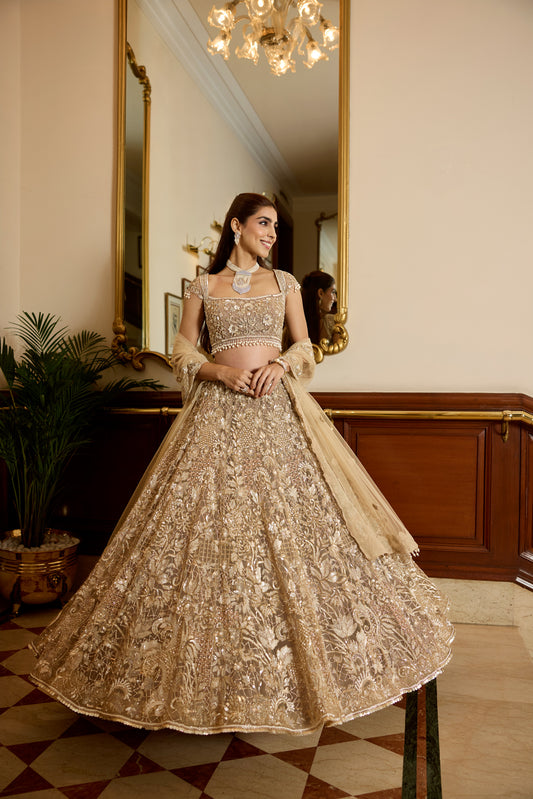 Luxury Indian bridal lehenga in champagne gold with modern blouse and designer dupatta by opus atelier