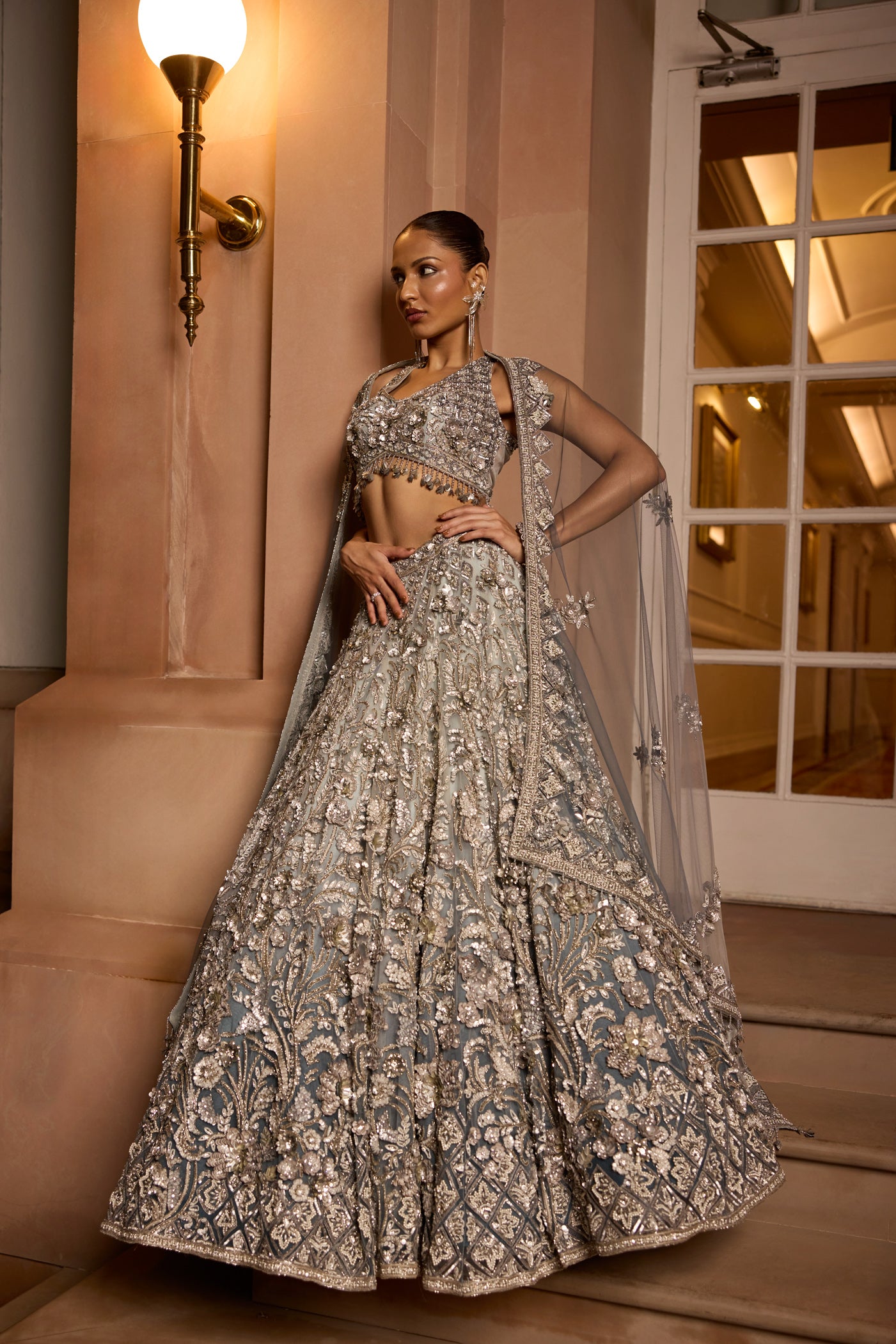 Grey silver to midnight blue ombré lehenga set with intricate zari and sequin embroidery, paired with blouse and dupatta by Opus Atelier, ideal for bridal receptions and evening cocktails