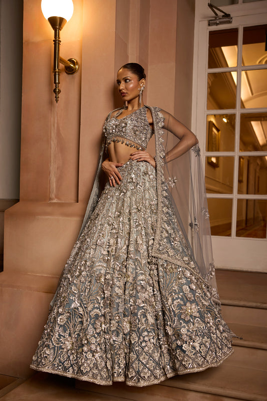 Grey silver to midnight blue ombré lehenga set with intricate zari and sequin embroidery, paired with blouse and dupatta by Opus Atelier, ideal for bridal receptions and evening cocktails