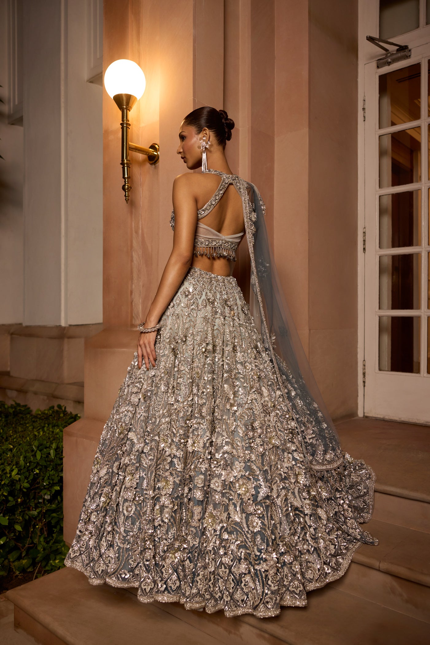 Grey silver to midnight blue ombré lehenga set with intricate zari and sequin embroidery, paired with trending blouse back design and dupatta by Opus Atelier, ideal for bridal receptions and evening cocktails