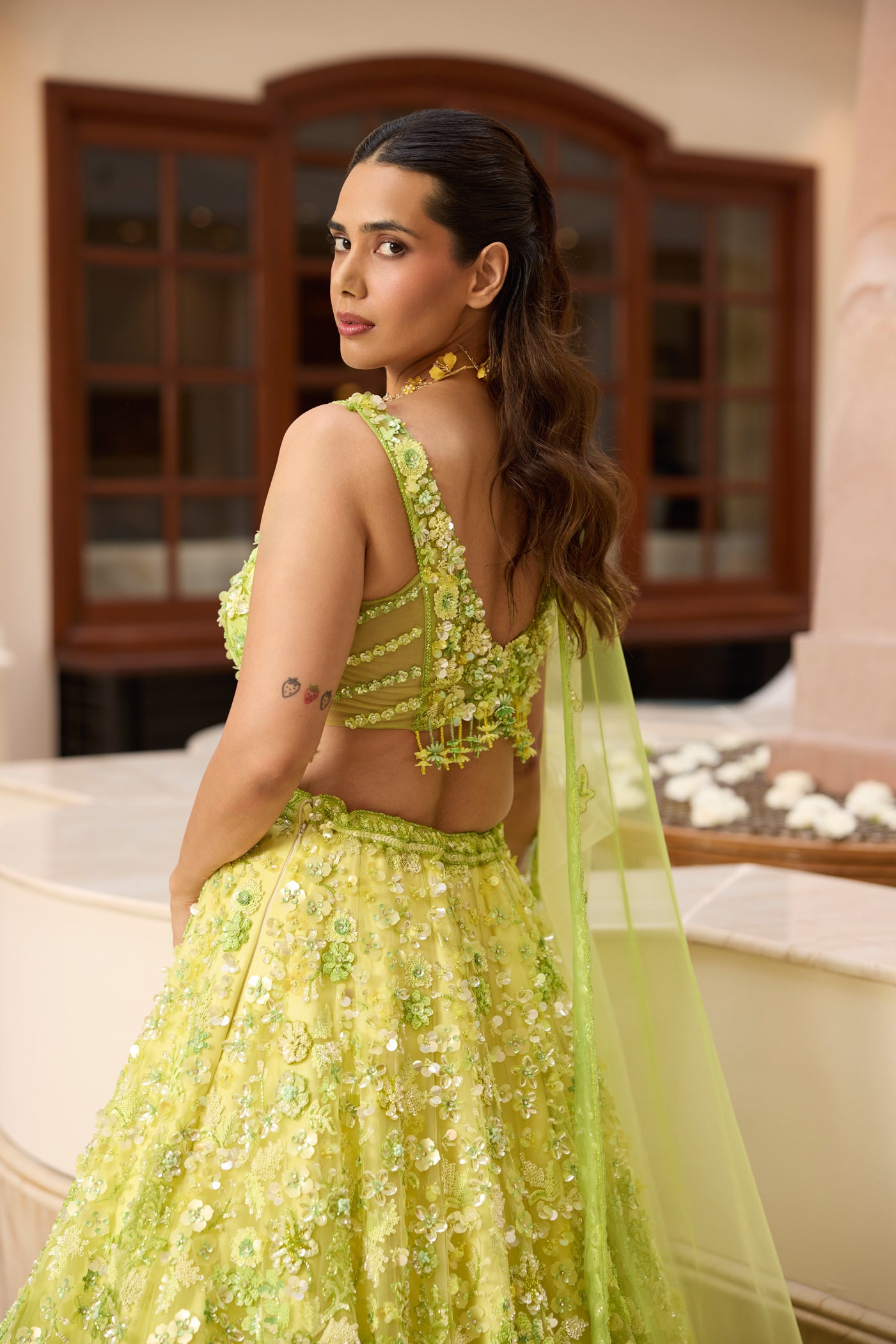 Designer lime green ombré embroidered lehenga set by Opus Atelier, featuring handcrafted floral motifs and sequins, ideal for bridal wear, destination weddings, and festive celebrations with blouse details