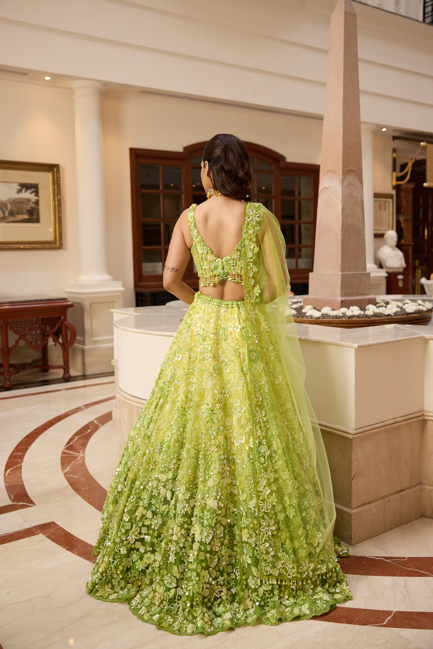 Designer lime green ombré embroidered lehenga set by Opus Atelier, featuring handcrafted floral motifs and sequins and trending blouse back design ideal for bridal wear, destination weddings, and festive celebrations