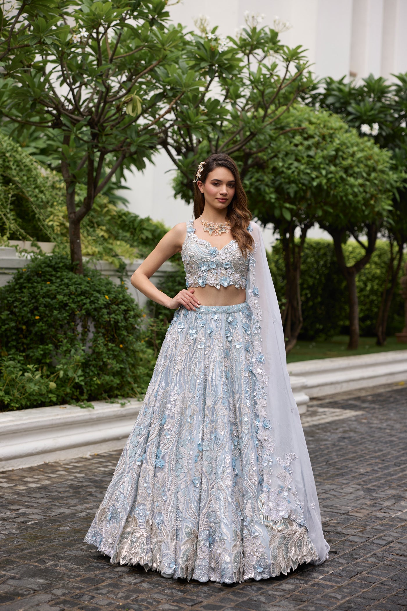 Elegant blue wedding lehenga with intricate floral embroidery and applique work