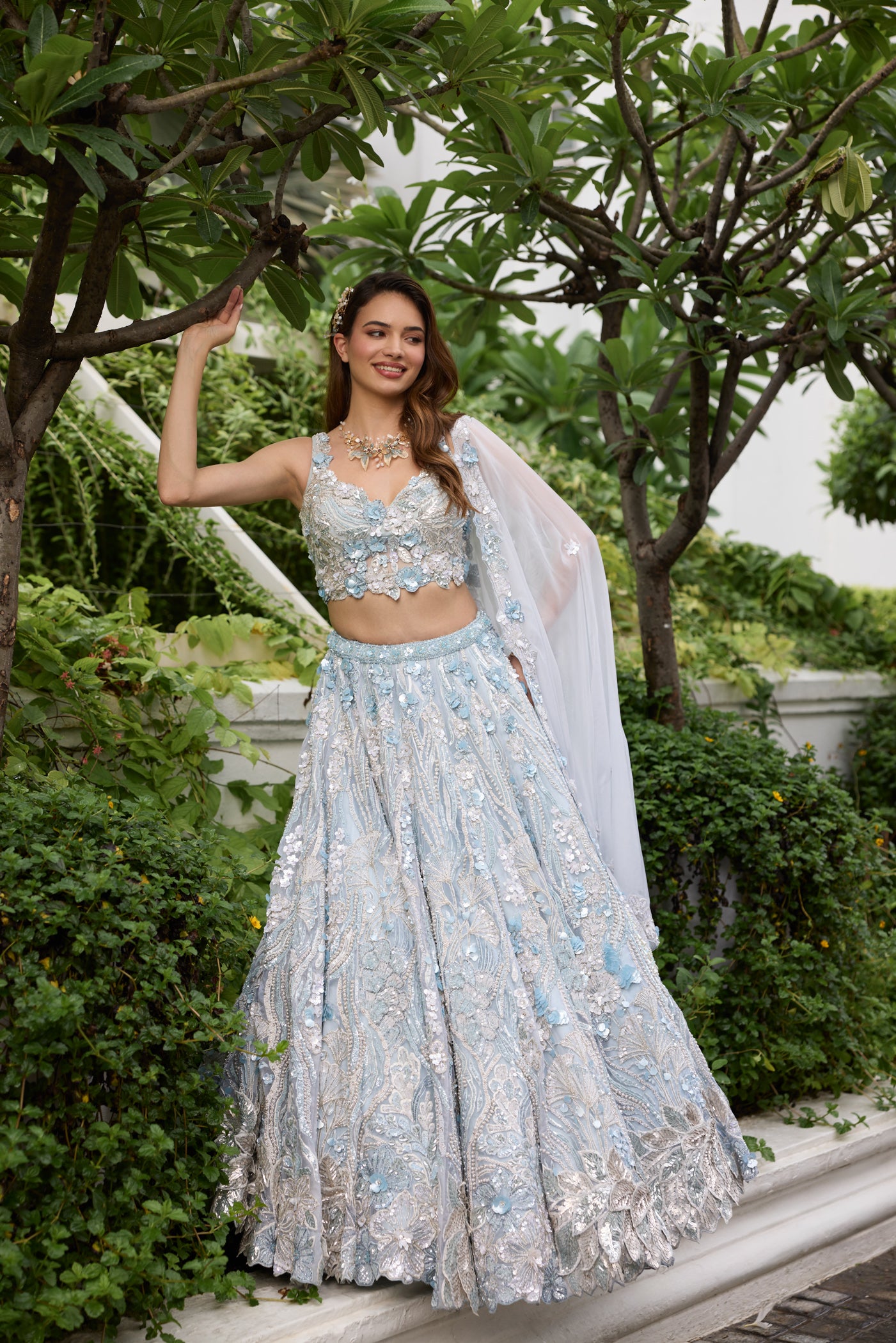 Powder blue lehenga with silver embroidery and floral 3D embellishments by Opus Atelier