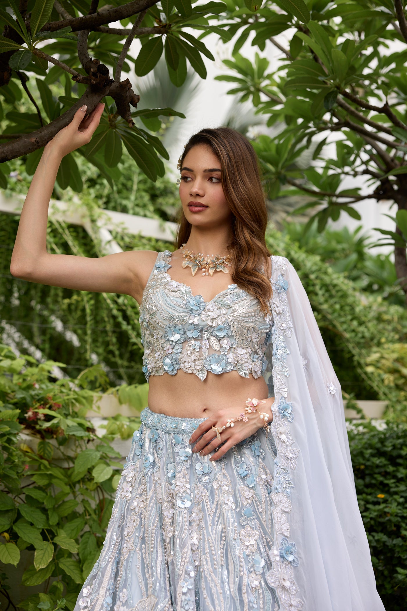 Powder blue lehenga with silver embroidery and floral 3D embellishments by Opus Atelier
