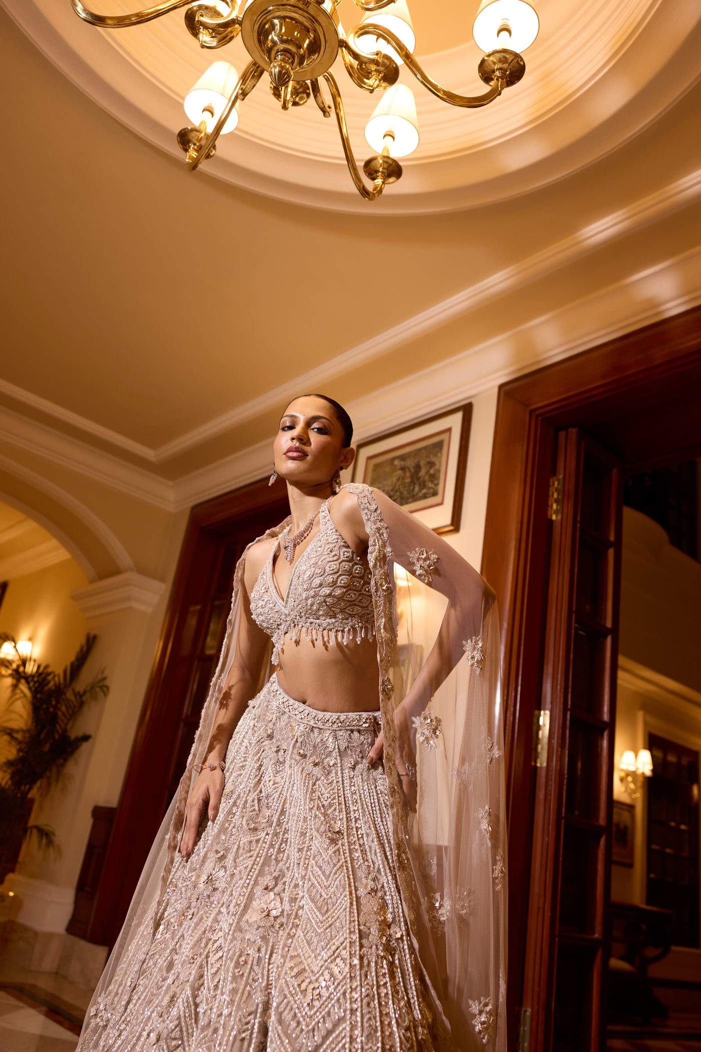Designer bridal reception lehenga with sheer dupatta and handcrafted embellishments by opus atelier