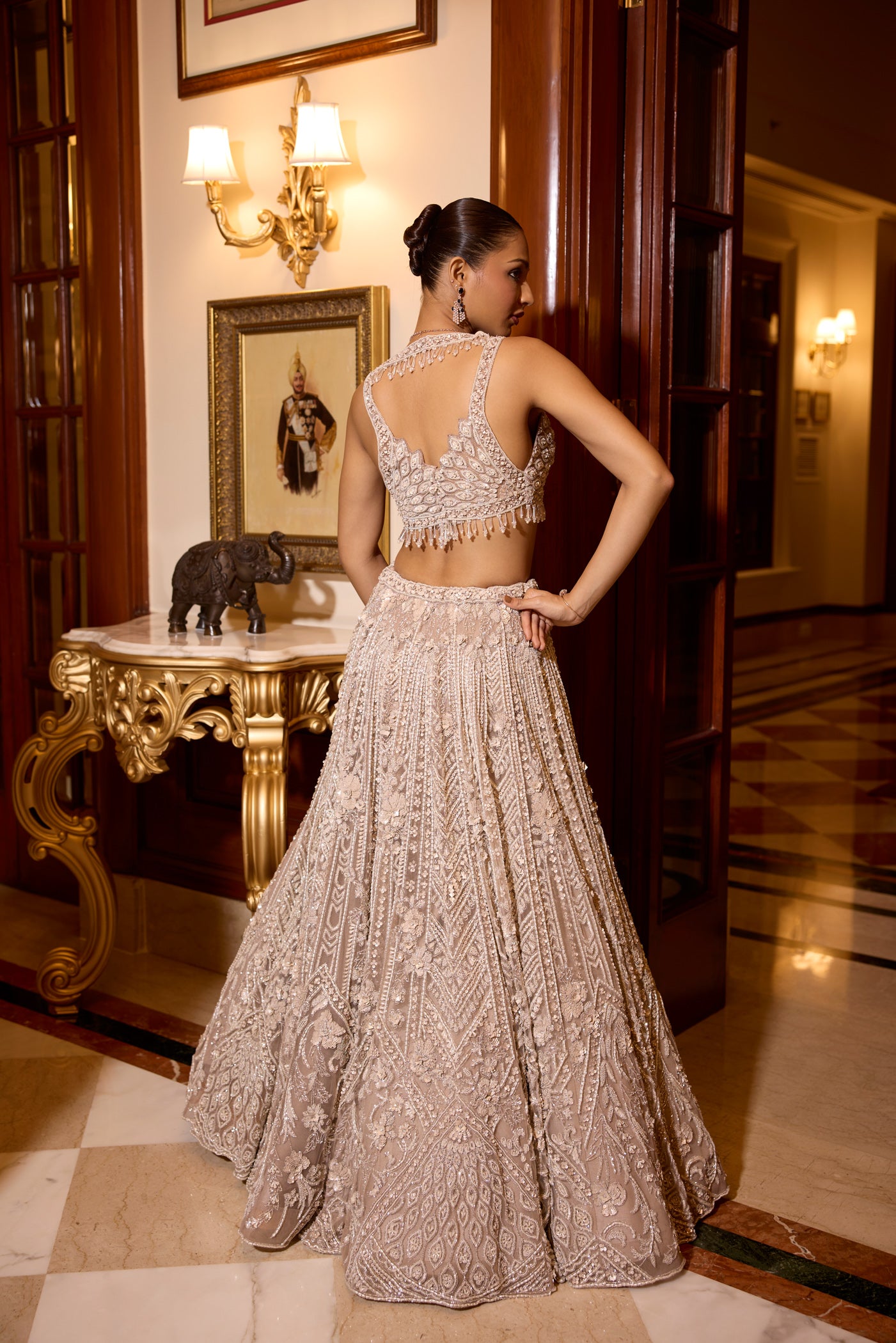 Designer bridal reception lehenga with trending blouse back design and tassles  embellishments by opus atelier