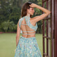 Aqua blue floral embroidered lehenga set with blouse and dupatta by Opus Atelier, handcrafted for modern brides, festive wear, and sangeet weddings