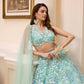 Aqua blue floral embroidered lehenga set with blouse and dupatta by Opus Atelier, handcrafted for modern brides, festive wear, and sangeet weddings