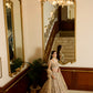 Golden wedding lehenga set with heavy embroidery and couture craftsmanship in a victorian era hotel by opus atelier