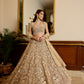 Luxury Indian bridal lehenga in champagne gold with modern blouse and designer dupatta by opus atelier