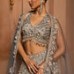Grey silver to midnight blue ombré lehenga set with intricate zari and sequin embroidery, paired with blouse and dupatta by Opus Atelier, ideal for bridal receptions and evening cocktails