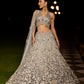Grey silver to midnight blue ombré lehenga set with intricate zari and sequin embroidery, paired with blouse and dupatta by Opus Atelier, ideal for bridal receptions and evening cocktails