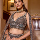 Intricately embroidered grey lehenga with silver sequins and floral motifs, worn with sheer shoulder drapes