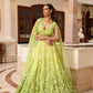Designer lime green ombré embroidered lehenga set by Opus Atelier, featuring handcrafted floral motifs and sequins, ideal for bridal wear, destination weddings, and festive celebrations