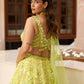 Designer lime green ombré embroidered lehenga set by Opus Atelier, featuring handcrafted floral motifs and sequins, ideal for bridal wear, destination weddings, and festive celebrations with blouse details