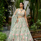 Pastel green floral embroidered lehenga with 3D multicolour flower motifs and detailed heavy dupatta by Opus Atelier