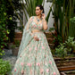 Pastel green floral embroidered lehenga with 3D multicolour flower motifs and detailed heavy dupatta by Opus Atelier