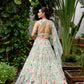 Modern couture lehenga with pastel tones, 3D flowers and elegant dupatta