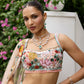 Peach pink lehenga with vibrant multicolour floral embroidery by Opus Atelier