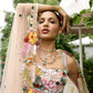 Peach pink lehenga with vibrant multicolour floral embroidery by Opus Atelier