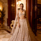 Designer bridal reception lehenga with sheer dupatta and handcrafted embellishments by opus atelier